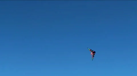 Stunt kite against blue sky wide - HD Stock Footage