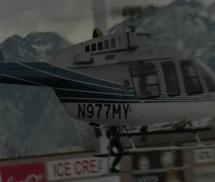 Stunt man hangs onto side of spinning helicopter Video stock 21526696