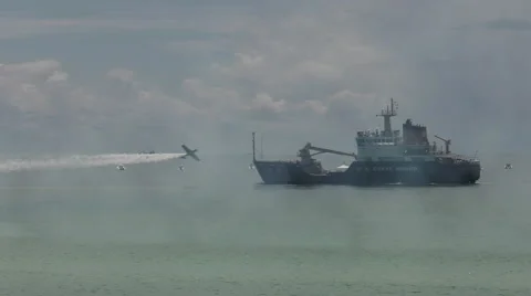 Stunt plane buzzes Coast Guard ship Stock-Footage 65166320