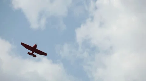 A Stunt Plane flies at an Air Show, recreation, danger, dangerous, war, airplane Stock Footage