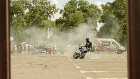 Stunt Riding Smoke To Keep Behind the Wheel Stock Footage 78339998