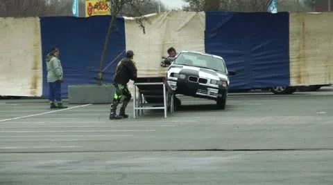 Stunt show, two wheels driving, man on the hood Stock Footage 11144645