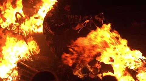 Stuntman driver of motorcycle in the fire Stock Footage 64754937