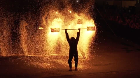 Stuntmen playing with carbon fire Stockbeeldmateriaal 234059146