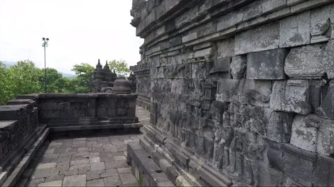 Stupa and Bas Relief on the wall, Borobudur Temple Terrace, Java, Indonesia Stock Footage 308740573