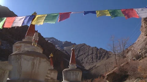 Stupas and prayer flags at background of Himalayan Mountains in Ladakh, India Stock Footage 45427853