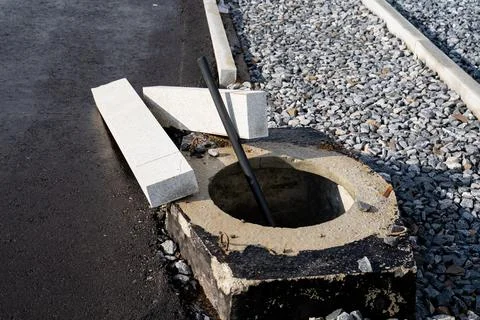 A sturdy and solid concrete block featuring a circular hole situated right .. 写真素材