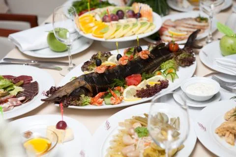 Sturgeon on the holiday table Stock Photos