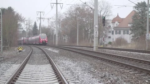 Stuttgart, Germany - 07/03/2024: Red Deutsche Bahn train speeds on track Stock Footage 278574402