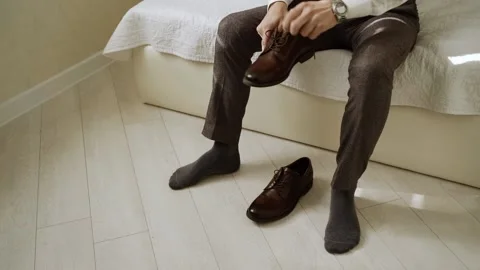 Style. Caucasian man wears dark-colored shoes Stock Footage 147656978