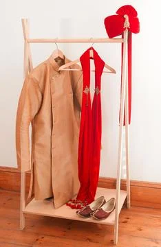 Style that makes all the right statements. mens clothing hanging on a rack in a Stock Photos