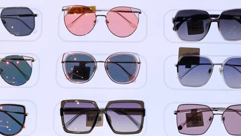 Style sunglasses displayed in store window shopping center. Fashionable glasses Stock Footage 257915301