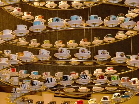 Styled Coffe Cups hanging from the ceiling at Eataly, Rome, Italian Food Emporiu Stock Photos