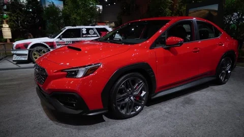 A stylish and eyecatching Red SUV showcased at the Auto Show event 스톡 동영상 291615115