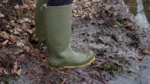 Stylish and Functional Green Rubber Boots for Navigating Wet Conditions Stock Footage 306013504