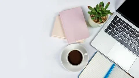 A Stylish and Modern Workspace Featuring a Laptop, Coffee, and Several Note.. Stock Photos