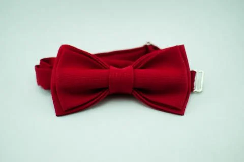 A stylish and well-designed red bow-tie on a white background; isolated Stock Photos
