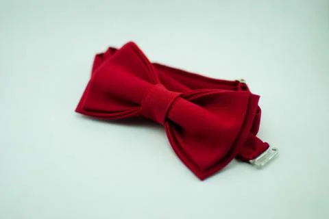 A stylish and well-designed red bow-tie on a white background; isolated Stock Photos