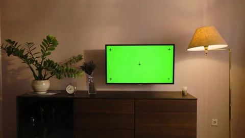 Stylish apartment interior with TV Set with green screen mock up display hangs Stock Footage 194493700