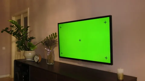 Stylish apartment interior with TV Set with green screen mock up display hangs Stock Footage 194494466