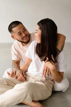 Stylish asian couple on grey Stock Photos