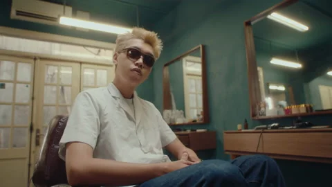 Stylish Asian Guy Posing for Camera in Barbershop Stock Footage 236821639
