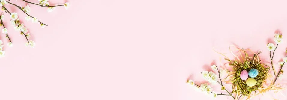 Stylish background with colorful easter eggs isolated on pink pastel backgrou Stock Photos