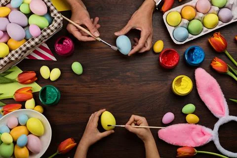 Stylish background with colorful easter eggs pastel colors on wooden background Stock Photos