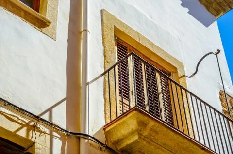 Stylish balcony with a metal railing, solid architectural element, a place of Stock Photos