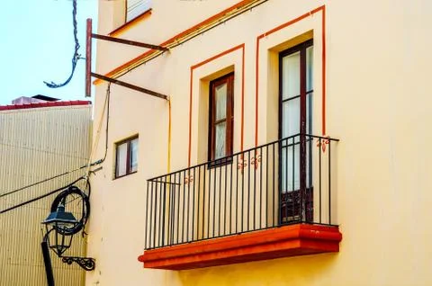 Stylish balcony with a metal railing, solid architectural element, a place Stock Photos