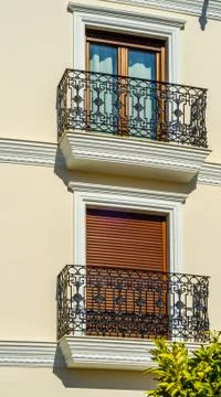 Stylish balcony with a metal railing, solid architectural element Stock Photos