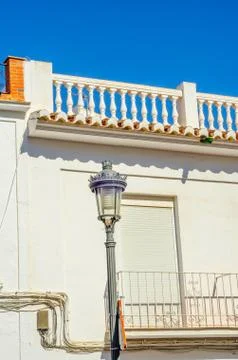 Stylish balcony with a metal railing, solid architectural element, a place Stock Photos
