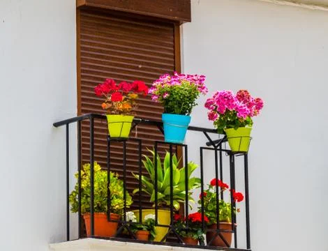 Stylish balcony with a metal railing, solid architectural element, a place of Stock Photos