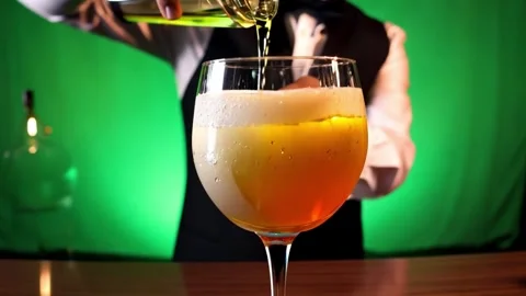 Stylish Bartender Pouring a Cocktail in a Modern Bar Setting Stock Footage 308438470