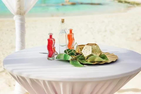 Stylish beach wedding table decor with sand bottles Stock Photos