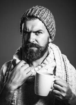 Stylish bearded man drinking coffee, cappuccino or tea from cup. Fashionable  Stock Photos