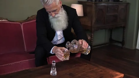 Stylish bearded senior man drinking whiskey Stock-Footage 233631204