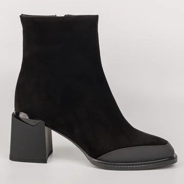 Stylish black ankle boot with a block heel designed for modern outfits suit.. 写真素材