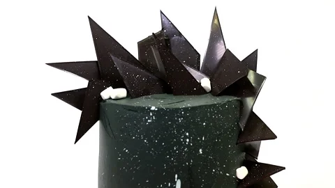 Stylish black cake with chocolates and marshmello on a white background Stock Footage 149894573