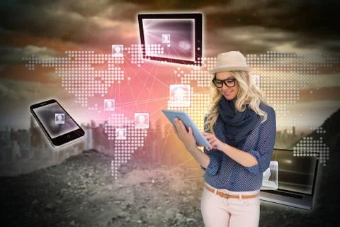 Stylish blonde using tablet pc with connecting devices Illustrazione stock