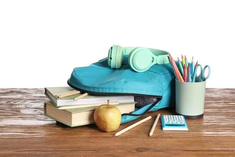 Stylish blue school backpack with different stationery supplies, apple and he Stock Photos