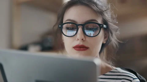 Stylish brunette working from home in her home office Stock Footage