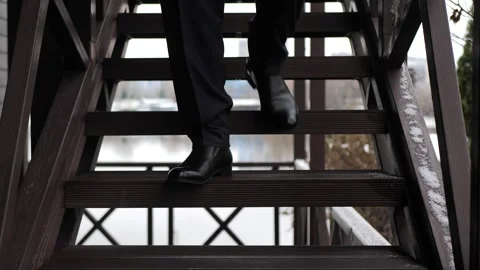 Stylish businessman with legs going down the stairs.front view. Stock Footage 260986808