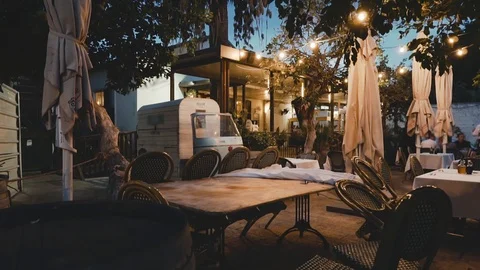 Stylish cafe, summer evening, Tel Aviv, Israel. Evening sunlight. Crane shot. Video stock 96090420