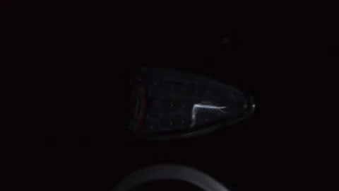 Stylish Car Indicator Lights that Shine Brightly in a Dark Environment for Stock Footage 308396181