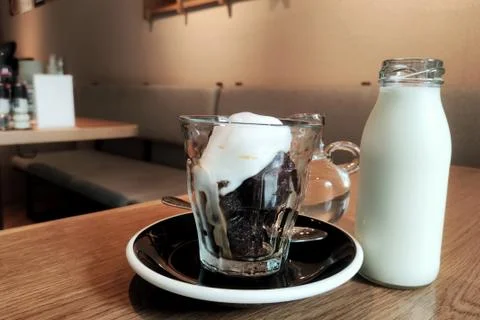 Stylish chic coffee block with soft cream. ice cool block of black coffee wit Stock Photos