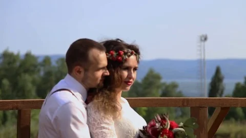 Stylish couple on a background of forest and mountains. 動画素材 69888650