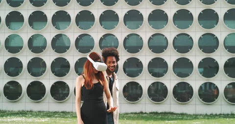Stylish couple having fun with vr goggles in the city Stock Footage 201134566