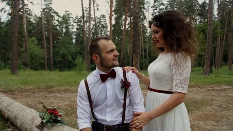 Stylish couple in a summer forest.The camera movement. Stock Footage 69885472