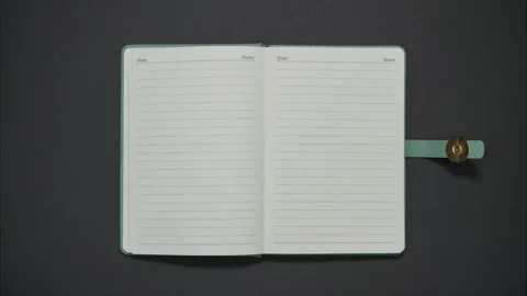 Stylish diary opens on blank page with word 'notes'. Stop motion animation Stock Footage 283261096